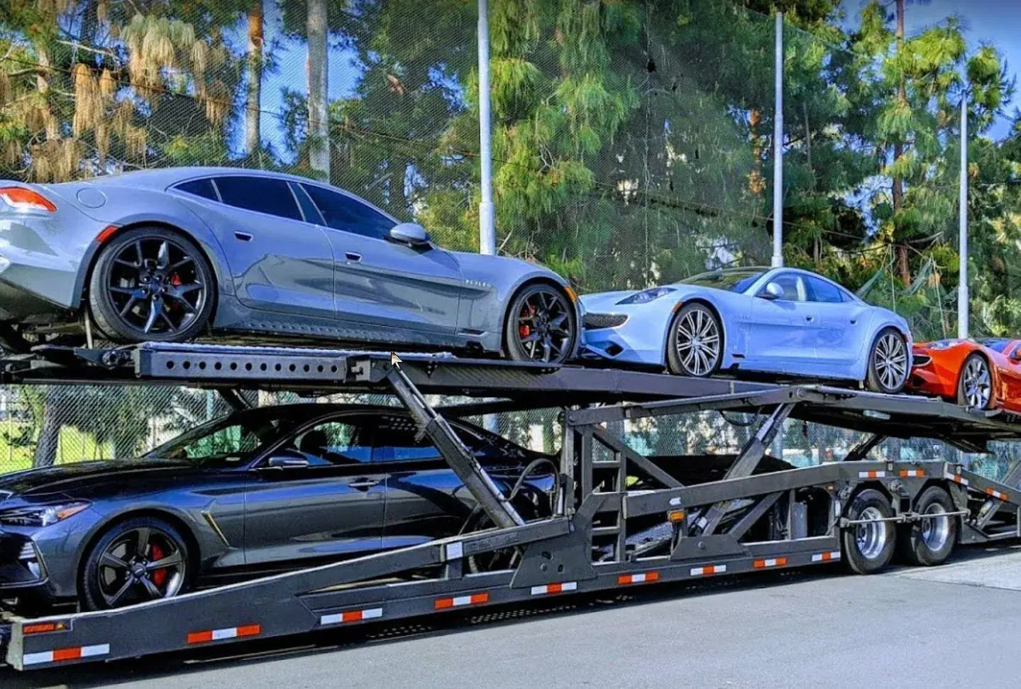 Vehicles on a car transport truck en route to their destination