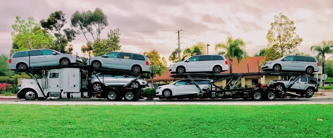Car carrier loaded with vehicles ready for cross-country transport