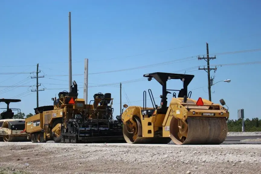 Heavy equipment being transported on a flatbed trailer